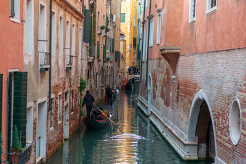 Gondolas on a water channel in Venice Italy 