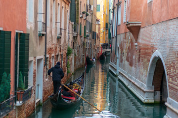 Obraz na płótnie Canvas gondolas on a canal in venice