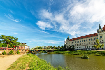 Fototapeta na wymiar Zrenjanin, Serbia - May 17, 2018: City lake, Bridge and Palace of Justice (Court House) in Zrenjanin.