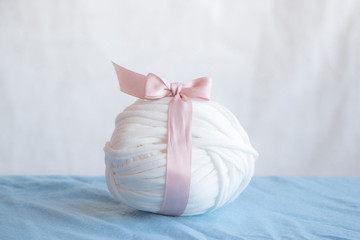 White yarn with pink bow and tape, gentle and nice simple picture for handmade stuff illustration.