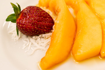 Detail tropical breakfast with organic fruit, strawberry, melon and coconut in Latin America, Guatemala.