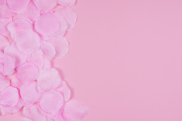 Pink rose petals as a background.