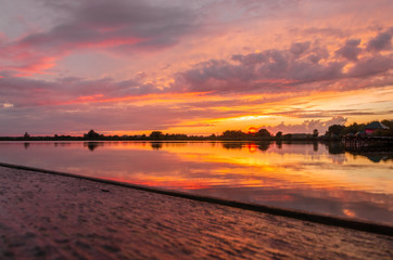 Fototapeta premium Dramatic sunset over the lake.