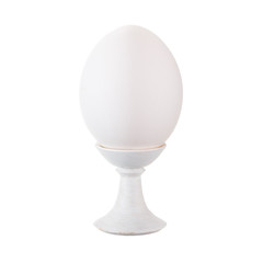 White egg on stand isolated on white background.
