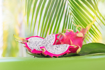 Fresh, tasty tropic, exotic dragon pitahya dragon fruit near palms