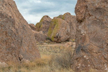 Giant boulders create a frame for a landscape covered with a jumble of huge, rounded rocks