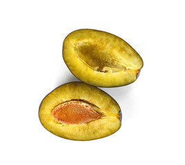  Plums cut in half isolated on white background