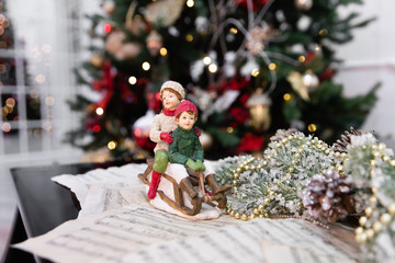 Christmas toys and christmas tree decoreted with garland 