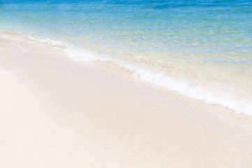 Perfect turquoise sea water with white sand