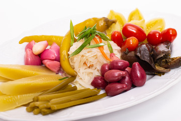 Pickles in assortment on a plate. Restaurant dish.