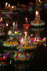 Fototapeta na wymiar Loy Krathong festival, People buy flowers and candle to light and float on water to celebrate the Loy Krathong festival in Thailand.