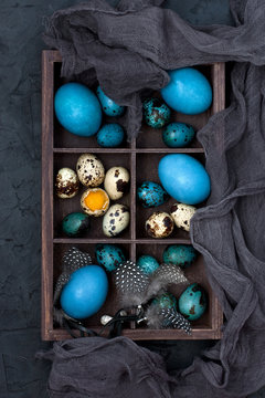 Easter colorful eggs in decorative wooden box, top view