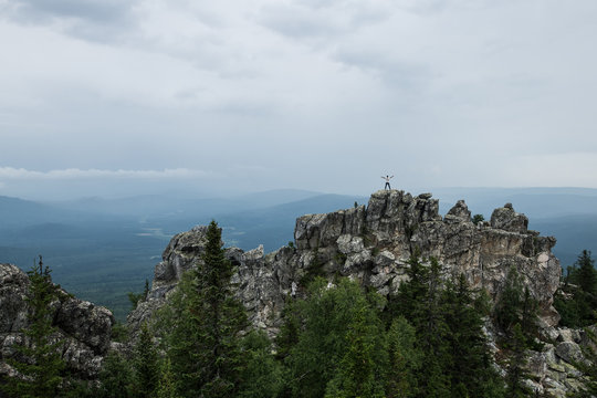 Man standing on the top of the rocks at Malinovaya mountain, Beloretsk, Bashkortostan
