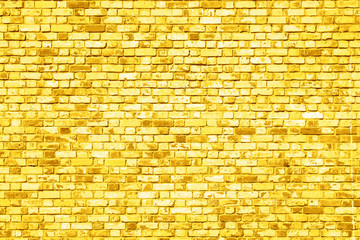 old  brick wall texture background painted in yellow