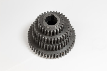 Metal gears wheels from large to small on white background . Repair parts, cogwheels, screw-wheels