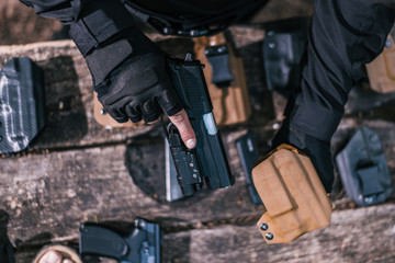 sports shooting instructor check your weapons close-up