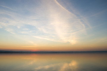 Beautiful red sunset over lake. Composition of nature.