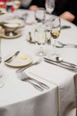 Table Setting in Restaurant, White Linens