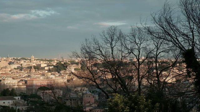 Camera sweeping pan left view of Rome cityscape seen from high angle Janiculum Terrace, Gianicolo Park viewpoint in Italy. 4K UHD at 29.97fps