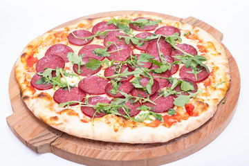 traditional Italian food: pizza with salami and salad