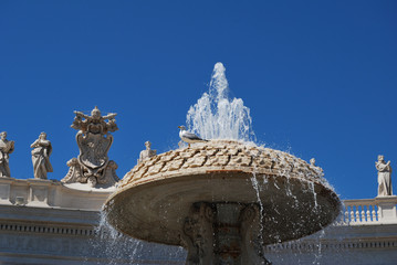 View of a fountain and the Basilica of Saint Peter in Vatican City - ROME, ITALY