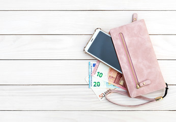 Woman's purse with money and smartphone on white wooden background. Top view. Space for text. - Powered by Adobe