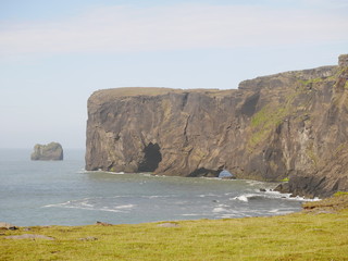 Fototapeta na wymiar Dyrholaey Peninsula with Sea Arches from cliff top