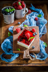Closeup of delicious cake with jelly and berry fruits