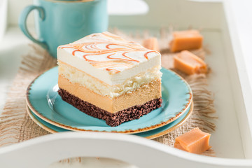 Closeup of cake on blue porcelain with fudge bars