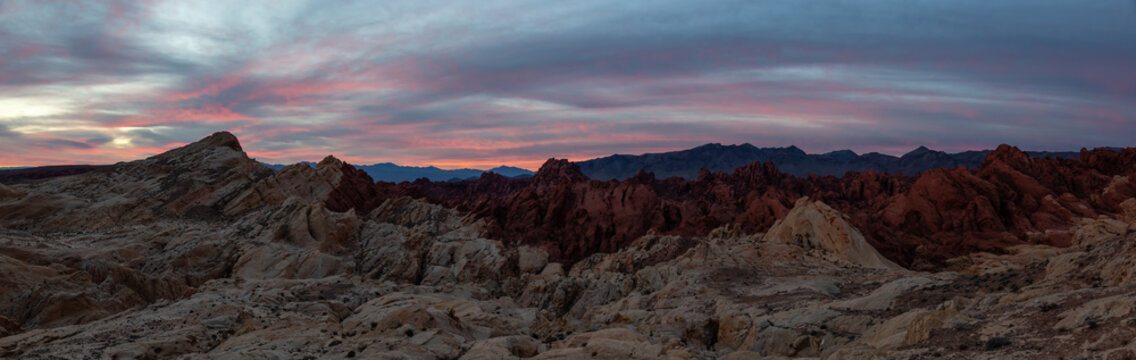 Beautiful panoramic American Landscape during a cloudy sunrise. Taken in Valley of Fire State Park, Nevada, United States.