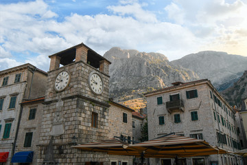 Fototapeta na wymiar The Clock Tower in the Piazza of the Arms, the main and largest town square in Kotor, Montenegro