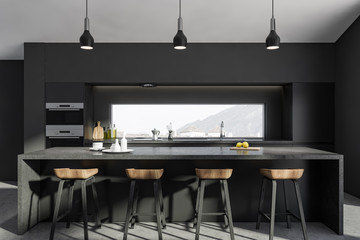 Dark gray kitchen with bar