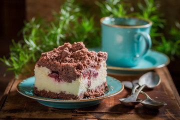 Closeup of rustic cheesecake served with coffee