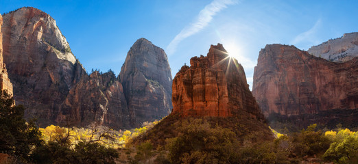 Fototapeta premium Beautiful panoramic landscape view of the Mountain Peaks in the Canyon during a sunny day. Taken in Zion National Park, Utah, United States.