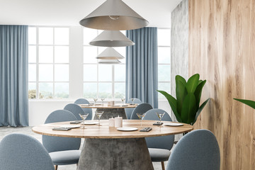 Interior of wooden cafe, blue chairs