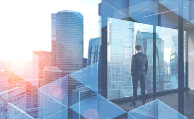 Fototapeta premium Businessman looks in office window, triangles
