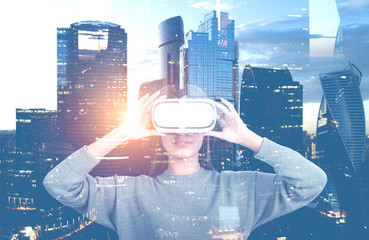 Woman in vr glasses in city