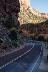 Scenic road in the Canyons during a sunny summer day. Taken in Zion National Park, Utah, United States.