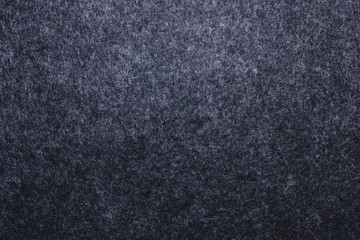Horizontal dark gray felted warm texture. Soft wool fabric