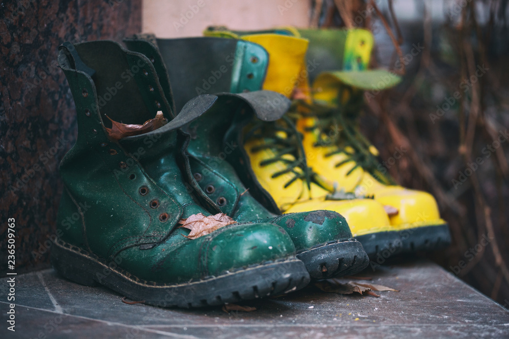 Wall mural Old leather boots of bright green and yellow colors