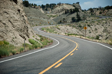 Curved road uphill in desert, USA