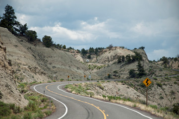 Curved road with traffic sign "bends"