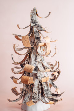 Tree bark Christmas tree on pink background