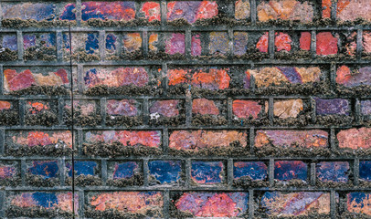 Multi coloured old brick wall