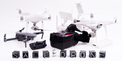 Flying drones on a white background with inscriptions "sale drone" 