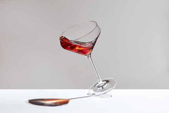Glass with splashing cocktail 