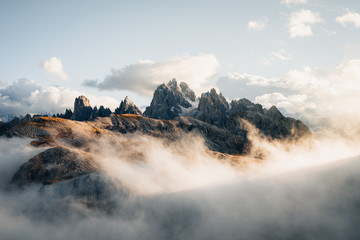 Mountains surrounded by billowing clouds