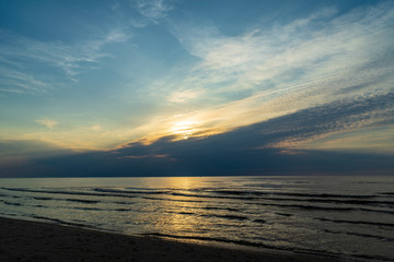 Obraz premium calm blue sunset over clear water in baltic sea