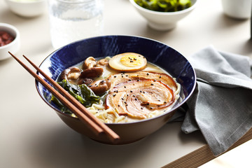 Tasty ramen soup with shiitake, hard boiled egg, sesame, wakame.