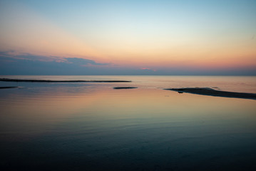 calm blue sunset over clear water in baltic sea